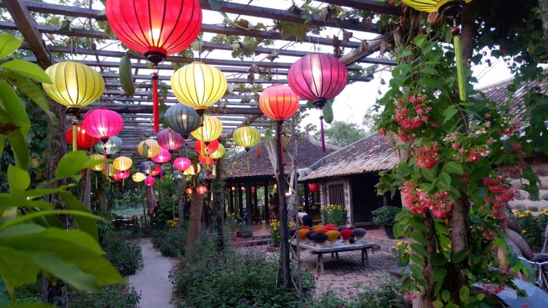 the garden space with colorful latterns mimic the vietnamese village scene at Nha Trang Xua restaurant