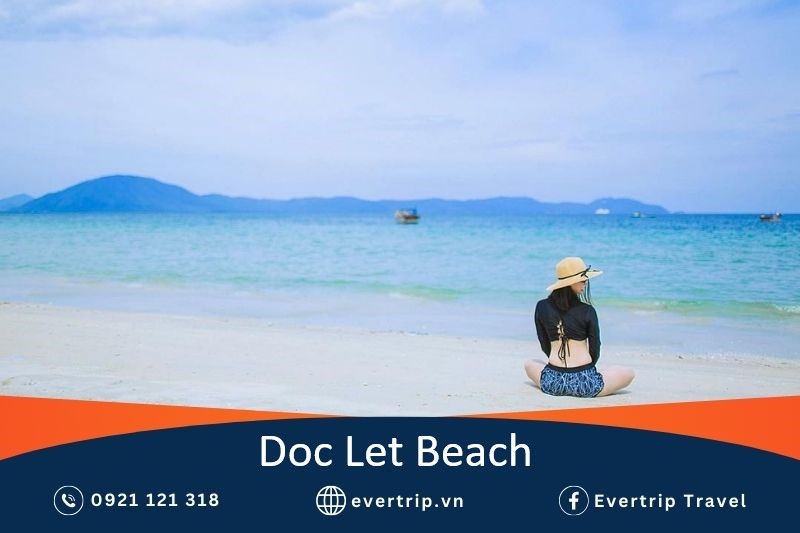 a girl sitting on the beach at doc let nha trang